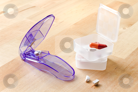 To use this stock image in your creative project, please select the size you need over to the right and click the "Add to Cart" button.
Your downloaded image will come with the Cutcaster watermark removed so don’t worry about the watermark you see on this page. Pillboxes and pill cutter stock photo, Pillboxes and pills cutted by pill cutter on wooden table by Colette Planken-Kooij