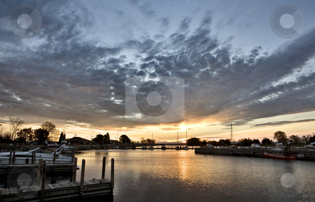 To use this stock image in your creative project, please select the size you need over to the right and click the "Add to Cart" button.
Your downloaded image will come with the Cutcaster watermark removed so don’t worry about the watermark you see on this page. Sunrise Escanaba Michigan stock photo, Sunrise Escanaba Michigan Marina Lake Michigan Dawn by Mark Duffy