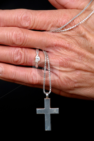 Woman praying Woman praying stock photo, Woman is praying holding her cross. On black clean background. by Lars Christensen