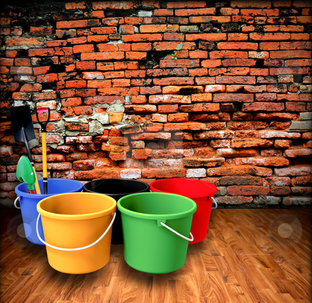 Bucket and shovel with a brick wall. Bucket and shovel with a brick wall. stock photo, Bucket and shovel with a brick wall. by rufous