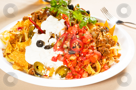 To use this stock image in your creative project, please select the size you need over to the right and click the "Add to Cart" button.
Your downloaded image will come with the Cutcaster watermark removed so don’t worry about the watermark you see on this page. Fresh nachos and vegetable salad with meat stock photo, fresh nachos and vegetable salad with meat ,chili con carne ,tipycal mexican food by Francesco Perre