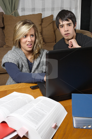 To use this stock image in your creative project, please select the size you need over to the right and click the "Add to Cart" button.
Your downloaded image will come with the Cutcaster watermark removed so don’t worry about the watermark you see on this page. Bad internet browsing experience stock photo, Two students doing homework come across something bad while browsing the internet. by © Ron Sumners
