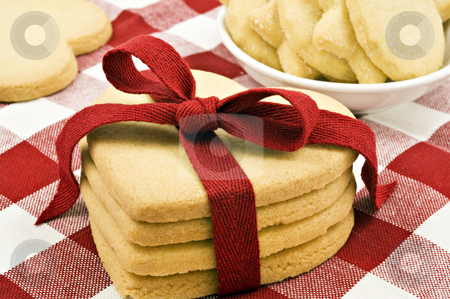 To use this stock image in your creative project, please select the size you need over to the right and click the "Add to Cart" button.
Your downloaded image will come with the Cutcaster watermark removed so don’t worry about the watermark you see on this page. Heart shaped cookies with red ribbon stock photo, Heart shaped cookies with red ribbon on cloth by tish1