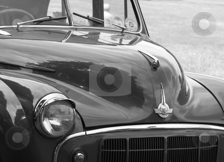 To use this stock image in your creative project, please select the size you need over to the right and click the "Add to Cart" button.
Your downloaded image will come with the Cutcaster watermark removed so don’t worry about the watermark you see on this page. Classic car 7 stock photo, a black and white image of a great briitsh classic car by lizapixels