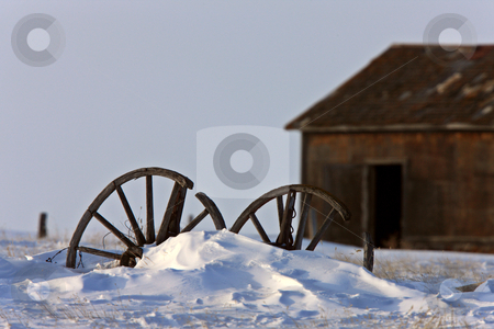 Wagon Wheel in Winter Saskatchewan Wagon Wheel in Winter Saskatchewan stock photo, Wagon Wheel in Winter Saskatchewan by Mark Duffy