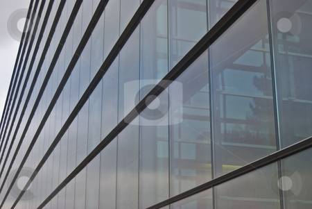 To use this stock image in your creative project, please select the size you need over to the right and click the "Add to Cart" button.
Your downloaded image will come with the Cutcaster watermark removed so don’t worry about the watermark you see on this page. Modern building stock photo, detail of a modern building made of glass and steel by Juliane Jacobs