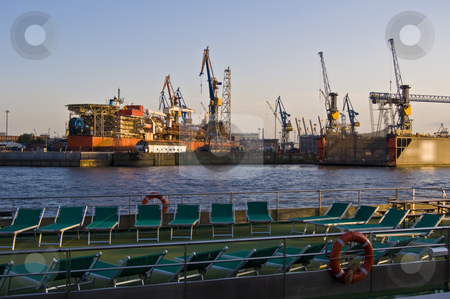 Docks Docks stock photo, deckchairs on one side of the Elbe, docks on the other by Juliane Jacobs