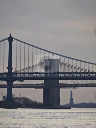 To use this stock image in your creative project, please select the size you need over to the right and click the "Add to Cart" button.
Your downloaded image will come with the Cutcaster watermark removed so don’t worry about the watermark you see on this page. Brooklyn Bridge stock photo, view of Brooklyn Bridge, Manhattan Bridge and Statue of Liberty in New York City by Juliane Jacobs