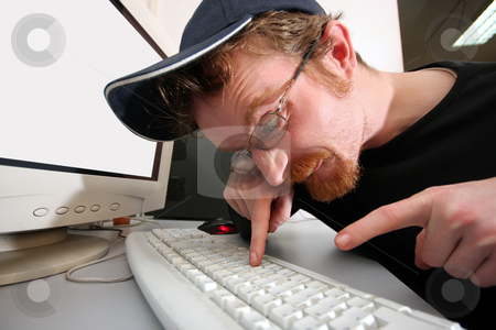 Mad programmer Mad programmer stock photo, mad programmer sitting at a computer desk by vladacanon1