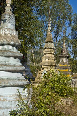 To use this stock image in your creative project, please select the size you need over to the right and click the "Add to Cart" button.
Your downloaded image will come with the Cutcaster watermark removed so don’t worry about the watermark you see on this page. Old cemetery stock photo, beautiful old colorful chedis on a a thai cemetery by Juliane Jacobs