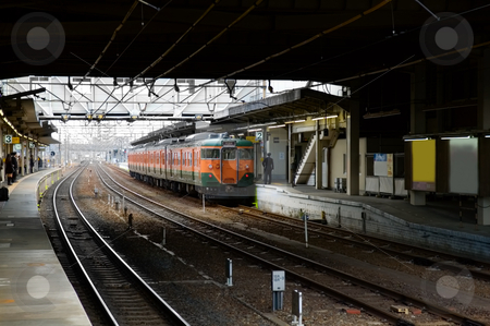 Train at station Train at station stock photo, Commuter train arriving at a train station by Tito Wong