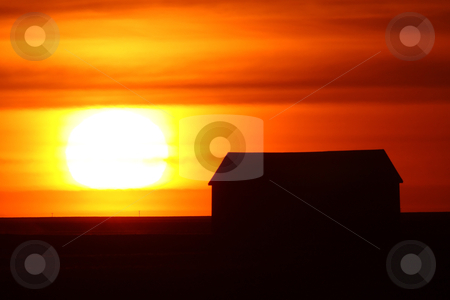 Setting sun backlighting farm buildings Setting sun backlighting farm buildings stock photo, Setting sun backlighting farm buildings by Mark Duffy