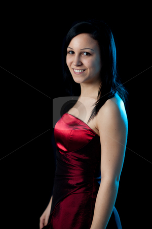 To use this stock image in your creative project, please select the size you need over to the right and click the "Add to Cart" button.
Your downloaded image will come with the Cutcaster watermark removed so don’t worry about the watermark you see on this page. Young womand portrait blue light stock photo, portrait of a young woman in a red dress lit by blue backlight by Jerax