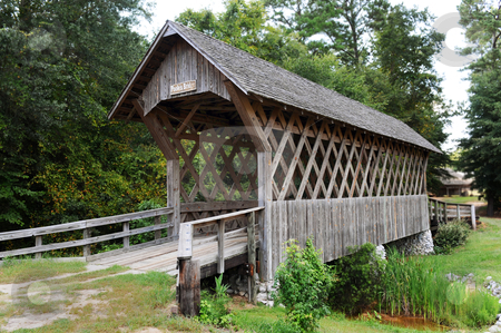 To use this stock image in your creative project, please select the size you need over to the right and click the "Add to Cart" button.
Your downloaded image will come with the Cutcaster watermark removed so don’t worry about the watermark you see on this page. Wood Covered bridge. stock photo, Wood covered bridge in troy,Alabama. by WScott