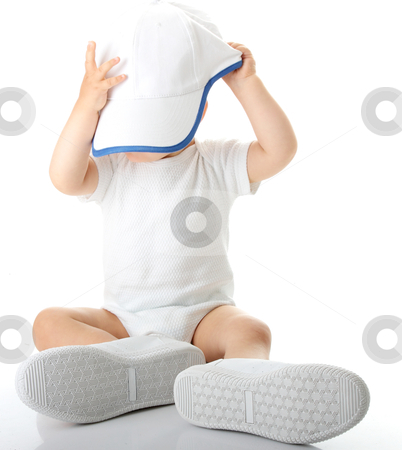 To use this stock image in your creative project, please select the size you need over to the right and click the "Add to Cart" button.
Your downloaded image will come with the Cutcaster watermark removed so don’t worry about the watermark you see on this page. Baby trying on shoes and basebal cap stock photo, Adorable baby trying on shoes and basebal cap that are way too big for him
by Piotr_Marcinski