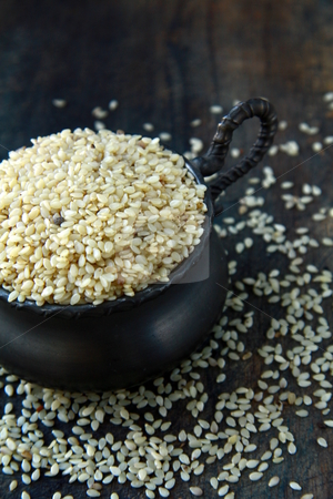 To use this stock image in your creative project, please select the size you need over to the right and click the "Add to Cart" button.
Your downloaded image will come with the Cutcaster watermark removed so don’t worry about the watermark you see on this page. Close up of sesame seeds on a wood table stock photo, Close up of sesame seeds on a wood table by Olga Kriger