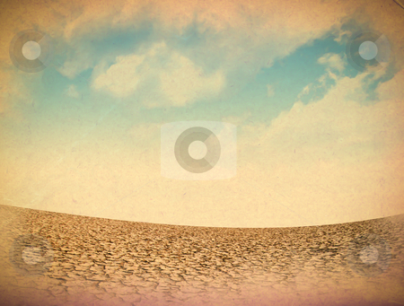 Dried and cracked soil in blue sky Dried and cracked soil in blue sky stock photo, Dried and cracked soil in blue sky by rufous