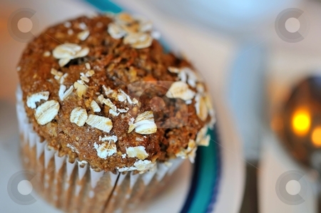 To use this stock image in your creative project, please select the size you need over to the right and click the "Add to Cart" button.
Your downloaded image will come with the Cutcaster watermark removed so don’t worry about the watermark you see on this page. Isolated muffin stock photo, Singe brown muffin on white plate. by Wai Chung Tang