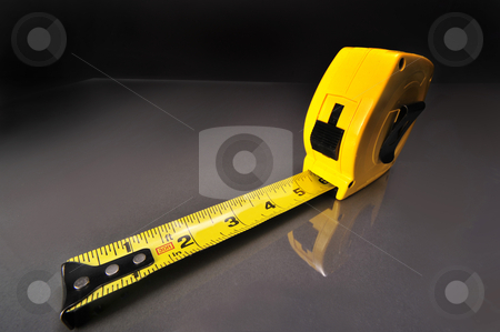 To use this stock image in your creative project, please select the size you need over to the right and click the "Add to Cart" button.
Your downloaded image will come with the Cutcaster watermark removed so don’t worry about the watermark you see on this page. Tape Measure stock photo, Yellow tape measure on work table. by WScott