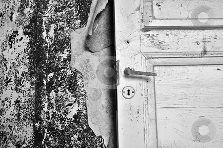 Torn wallpaper Torn wallpaper stock photo, Torn wallpaper and old door in abandoned house. Black and white. by sirylok