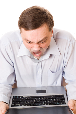 young man blamed for a laptop on a white background young man blamed for a laptop on a white background stock photo, handsome young man blamed for a laptop on a white background by Alevtina Guzova