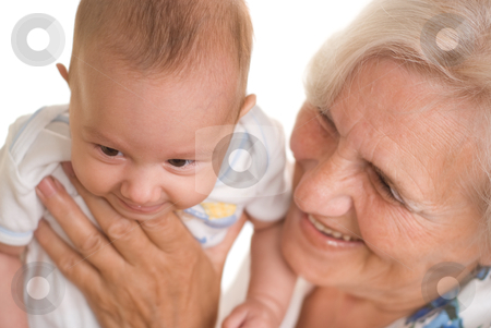 Elderly woman holding a newborn Elderly woman holding a newborn stock photo, elderly woman holding a newborn in her arms by Alevtina Guzova
