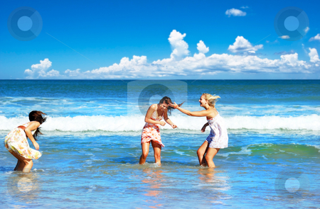 To use this stock image in your creative project, please select the size you need over to the right and click the "Add to Cart" button.
Your downloaded image will come with the Cutcaster watermark removed so don’t worry about the watermark you see on this page. Three young woman having fun on the beach on a summer day stock photo, Three young woman having fun on the beach on a summer day by tish1