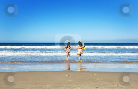 To use this stock image in your creative project, please select the size you need over to the right and click the "Add to Cart" button.
Your downloaded image will come with the Cutcaster watermark removed so don’t worry about the watermark you see on this page. Two young woman having fun on the beach on a summer day stock photo, Two young woman having fun on the beach on a summer day by tish1