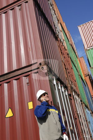 To use this stock image in your creative project, please select the size you need over to the right and click the "Add to Cart" button.
Your downloaded image will come with the Cutcaster watermark removed so don’t worry about the watermark you see on this page. Port worker with containers stock photo, dock and port worker with stacks of containers in background by lagereek