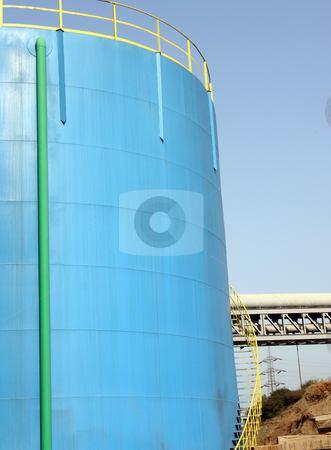To use this stock image in your creative project, please select the size you need over to the right and click the "Add to Cart" button.
Your downloaded image will come with the Cutcaster watermark removed so don’t worry about the watermark you see on this page. Petrol blue tank stock photo, A big petrol blue tank to deposit gasoline by Roberto Giobbi