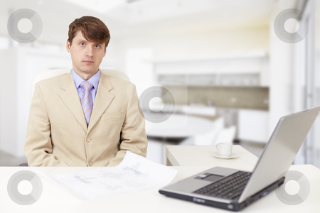 Young serious businessman on a workplace Young serious businessman on a workplace stock photo, The young serious businessman on a workplace with the laptop by Alexey Romanov