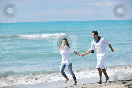 To use this stock image in your creative project, please select the size you need over to the right and click the "Add to Cart" button.
Your downloaded image will come with the Cutcaster watermark removed so don’t worry about the watermark you see on this page. Happy young couple have fun at beautiful beach stock photo, happy young couple in white clothing have romantic recreation and fun at beautiful beach on vacations by Benis Arapovic