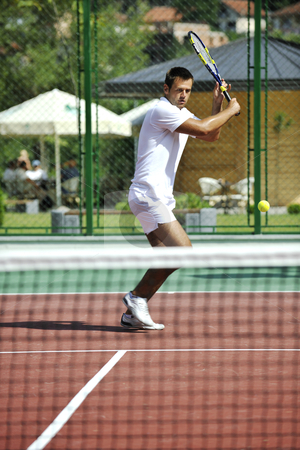 To use this stock image in your creative project, please select the size you need over to the right and click the "Add to Cart" button.
Your downloaded image will come with the Cutcaster watermark removed so don’t worry about the watermark you see on this page. Young man play tennis outdoor stock photo, young man play tennis outdoor on orange tennis court at early morning by Benis Arapovic