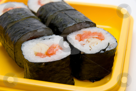Close up of sushi roll Close up of sushi roll stock photo, Close up of sushi roll on yellow plate by olinchuk