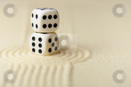 To use this stock image in your creative project, please select the size you need over to the right and click the "Add to Cart" button.
Your downloaded image will come with the Cutcaster watermark removed so don’t worry about the watermark you see on this page. Two white dice with black dots on sand stock photo, Two white dice with black dots in Japanese rock-garden by Alexey Romanov