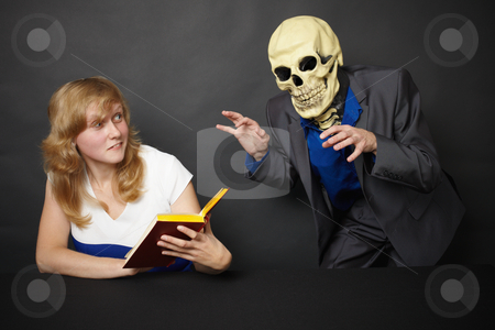 To use this stock image in your creative project, please select the size you need over to the right and click the "Add to Cart" button.
Your downloaded image will come with the Cutcaster watermark removed so don’t worry about the watermark you see on this page. Hallucination stock photo, A young woman experiences hallucinations - funny skeleton by Alexey Romanov