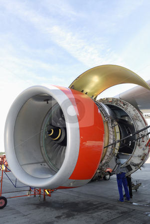 To use this stock image in your creative project, please select the size you need over to the right and click the "Add to Cart" button.
Your downloaded image will come with the Cutcaster watermark removed so don’t worry about the watermark you see on this page. Mechanic and jet engine stock photo, mechanic working inside giant jumbo jet engine, ground maintenance by lagereek
