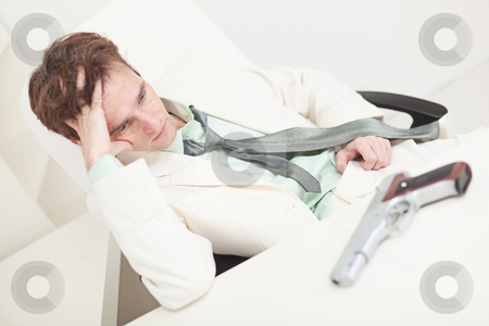 To use this stock image in your creative project, please select the size you need over to the right and click the "Add to Cart" button.
Your downloaded image will come with the Cutcaster watermark removed so don’t worry about the watermark you see on this page. Depressed businessman to prepare for kill oneself stock photo, The depressed businessman to prepare for kill oneself by Alexey Romanov