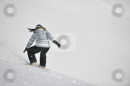 To use this stock image in your creative project, please select the size you need over to the right and click the "Add to Cart" button.
Your downloaded image will come with the Cutcaster watermark removed so don’t worry about the watermark you see on this page. Snowboard woman stock photo, snowboard woman racing downhill slope and freeride on powder snow at winter season and sunny day by Benis Arapovic