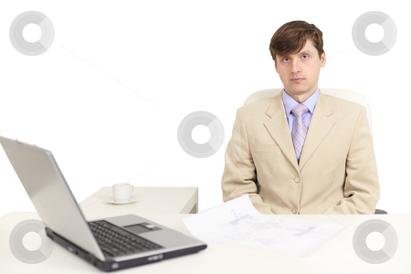 Young serious person on a workplace Young serious person on a workplace stock photo, The young serious person on a workplace with the laptop by Alexey Romanov