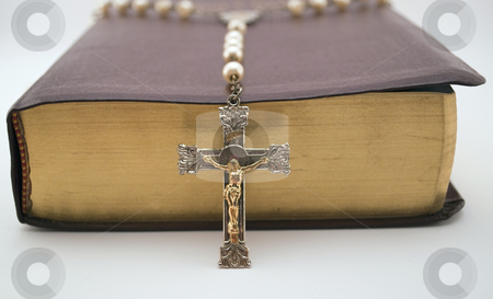 To use this stock image in your creative project, please select the size you need over to the right and click the "Add to Cart" button.
Your downloaded image will come with the Cutcaster watermark removed so don’t worry about the watermark you see on this page. Rosary on Holy Bible stock photo, Low angle shot of rosary leaning over the side of a closed bible by Michael T