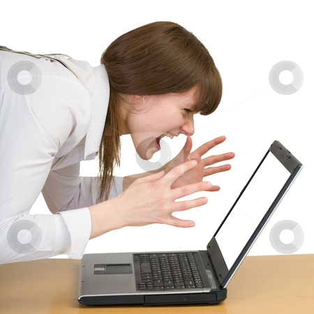 To use this stock image in your creative project, please select the size you need over to the right and click the "Add to Cart" button.
Your downloaded image will come with the Cutcaster watermark removed so don’t worry about the watermark you see on this page. Girl emotionally shouts at the laptop stock photo, Young girl emotionally shouts at the laptop by Alexey Romanov