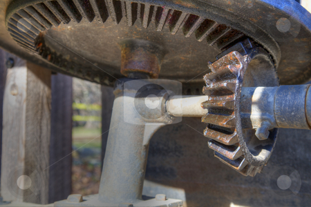 To use this stock image in your creative project, please select the size you need over to the right and click the "Add to Cart" button.
Your downloaded image will come with the Cutcaster watermark removed so don’t worry about the watermark you see on this page. Big gears stock photo, Subtle high dynamic range image of a bevel gear mechanism by bobkeenan