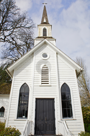 To use this stock image in your creative project, please select the size you need over to the right and click the "Add to Cart" button.
Your downloaded image will come with the Cutcaster watermark removed so don’t worry about the watermark you see on this page. Small old Chruch stock photo, Small old Church with two windows and black door with trees and sky background by bobkeenan