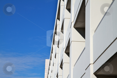 To use this stock image in your creative project, please select the size you need over to the right and click the "Add to Cart" button.
Your downloaded image will come with the Cutcaster watermark removed so don’t worry about the watermark you see on this page. Tan Building sky clouds stock photo, Tan Building in perspective with blue sky and clouds background by bobkeenan