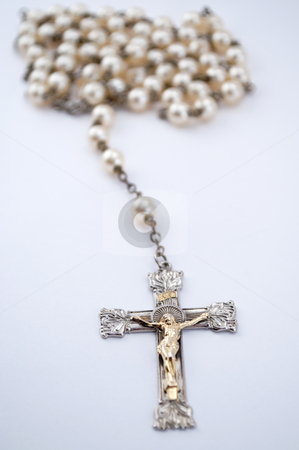 Isolated Rosary With Blurred out Beads Isolated Rosary With Blurred out Beads stock photo, Isolated rosary with beads blurred out in the back ground by Michael T