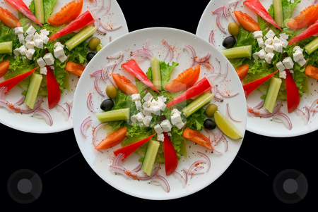 Plates with salad Plates with salad stock photo, Group of plates with salad on black background. by olinchuk