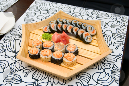 To use this stock image in your creative project, please select the size you need over to the right and click the "Add to Cart" button.
Your downloaded image will come with the Cutcaster watermark removed so don’t worry about the watermark you see on this page. Sushi on wood plate stock photo, At restaurant: Set of sushi on wood plate. by olinchuk