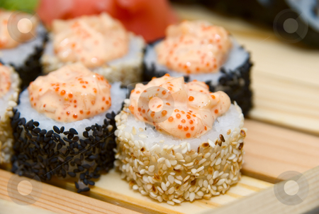 Sushi Sushi stock photo, Close-up of of sushi on wood plate. by olinchuk