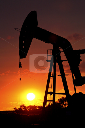 To use this stock image in your creative project, please select the size you need over to the right and click the "Add to Cart" button.
Your downloaded image will come with the Cutcaster watermark removed so don’t worry about the watermark you see on this page. Oil rig pump jack silhouetted by setting sun stock photo, Oil rig pump jack silhouetted by setting sun by Mark Duffy